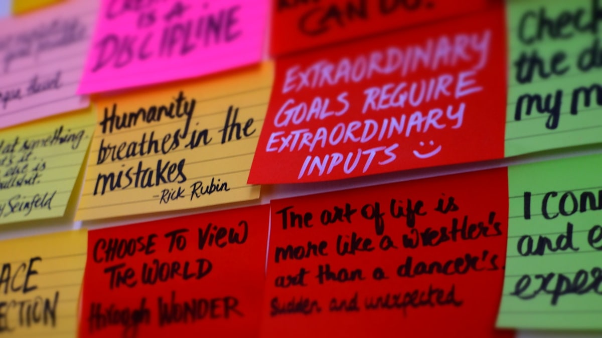 Colorful sticky notes with motivational quotes written